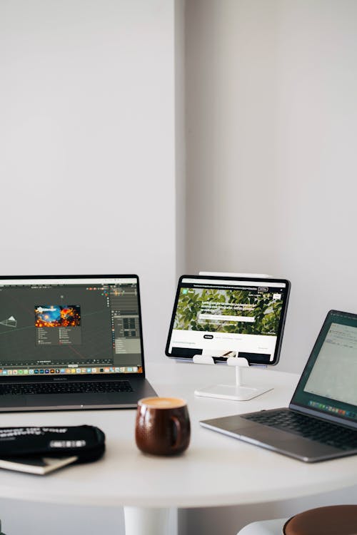 3 computers on the table