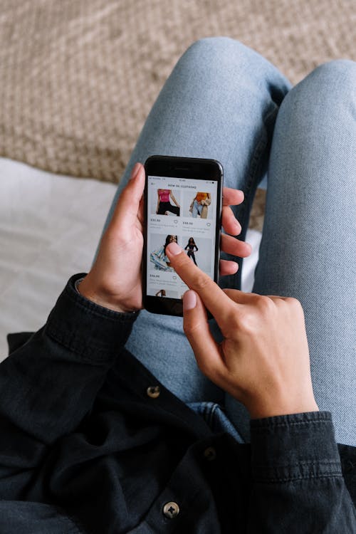 woman scrolling mobile commerce website