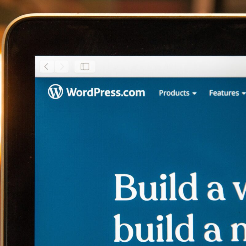 A close-up of a WordPress website screen, highlighting WordPress as a popular CMS option and emphasizing key features to consider in a CMS for web development.