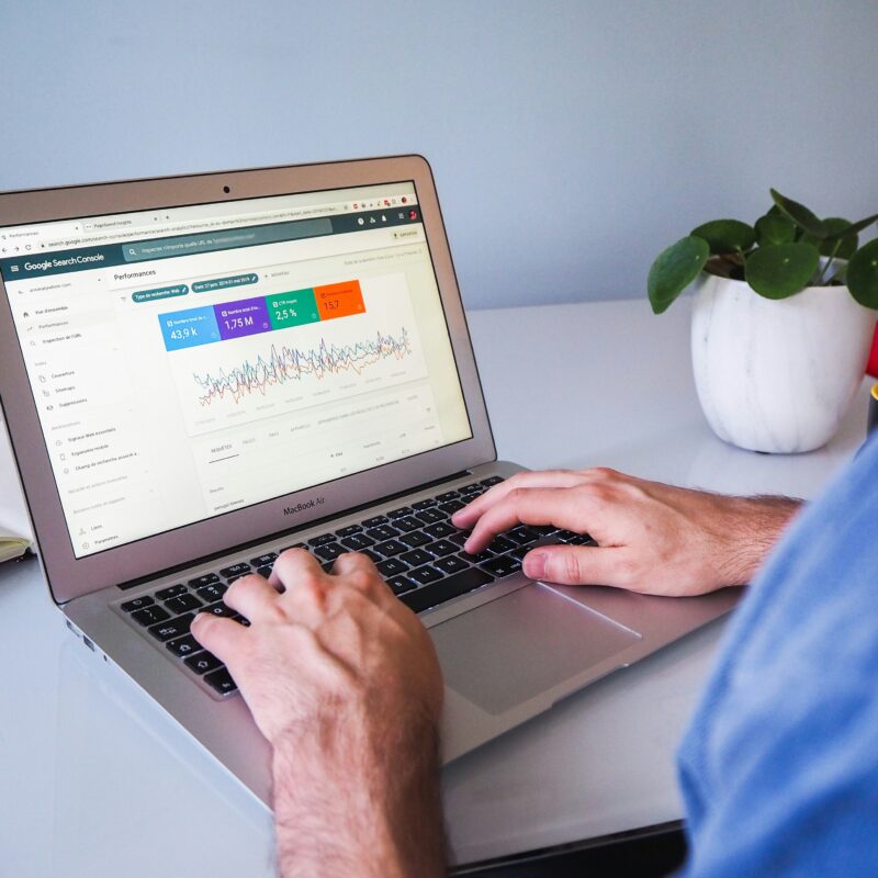A person analyzing backlink metrics and SEO performance on Google Search Console, highlighting how link building tools enhance visibility and rankings.
