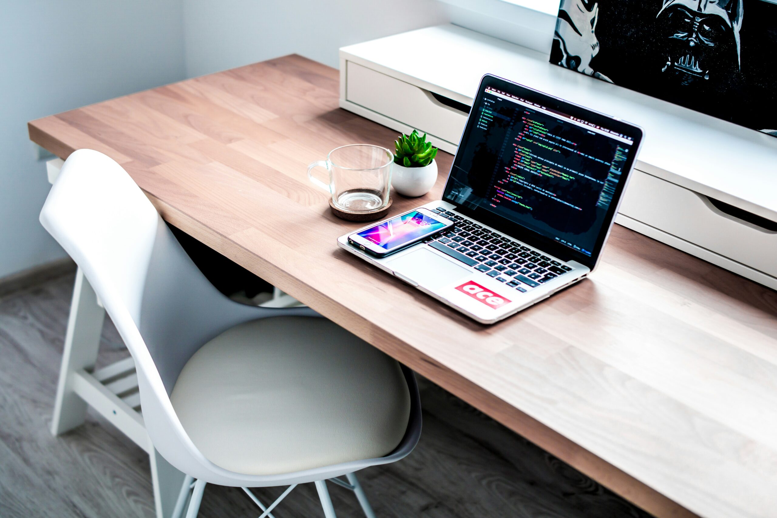 A laptop displaying coding scripts next to a smartphone on a clean desk, illustrating efforts to streamline code and boost mobile load times by optimizing JavaScript, CSS, and server response. | Day by Day Digital A laptop displaying coding scripts next to a smartphone on a clean desk, illustrating efforts to streamline code and boost mobile load times by optimizing JavaScript, CSS, and server response.