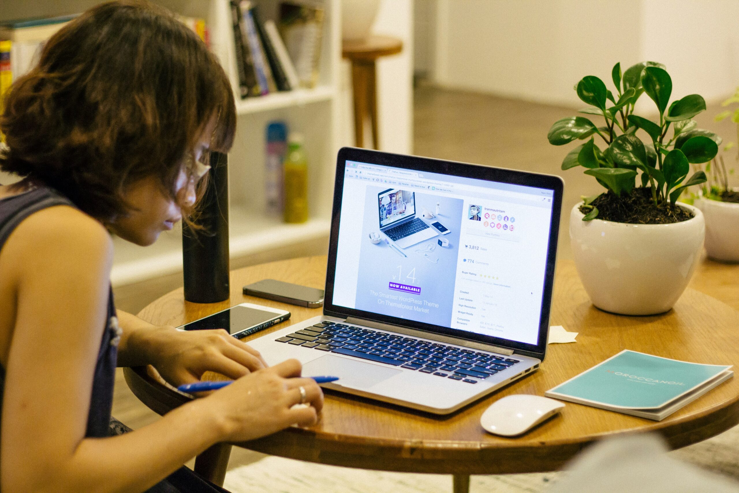A woman analyzes website layout on her laptop, illustrating how strategic content structuring supports better keyword visibility and SEO performance. | Day by Day Digital A woman analyzes website layout on her laptop, illustrating how strategic content structuring supports better keyword visibility and SEO performance.