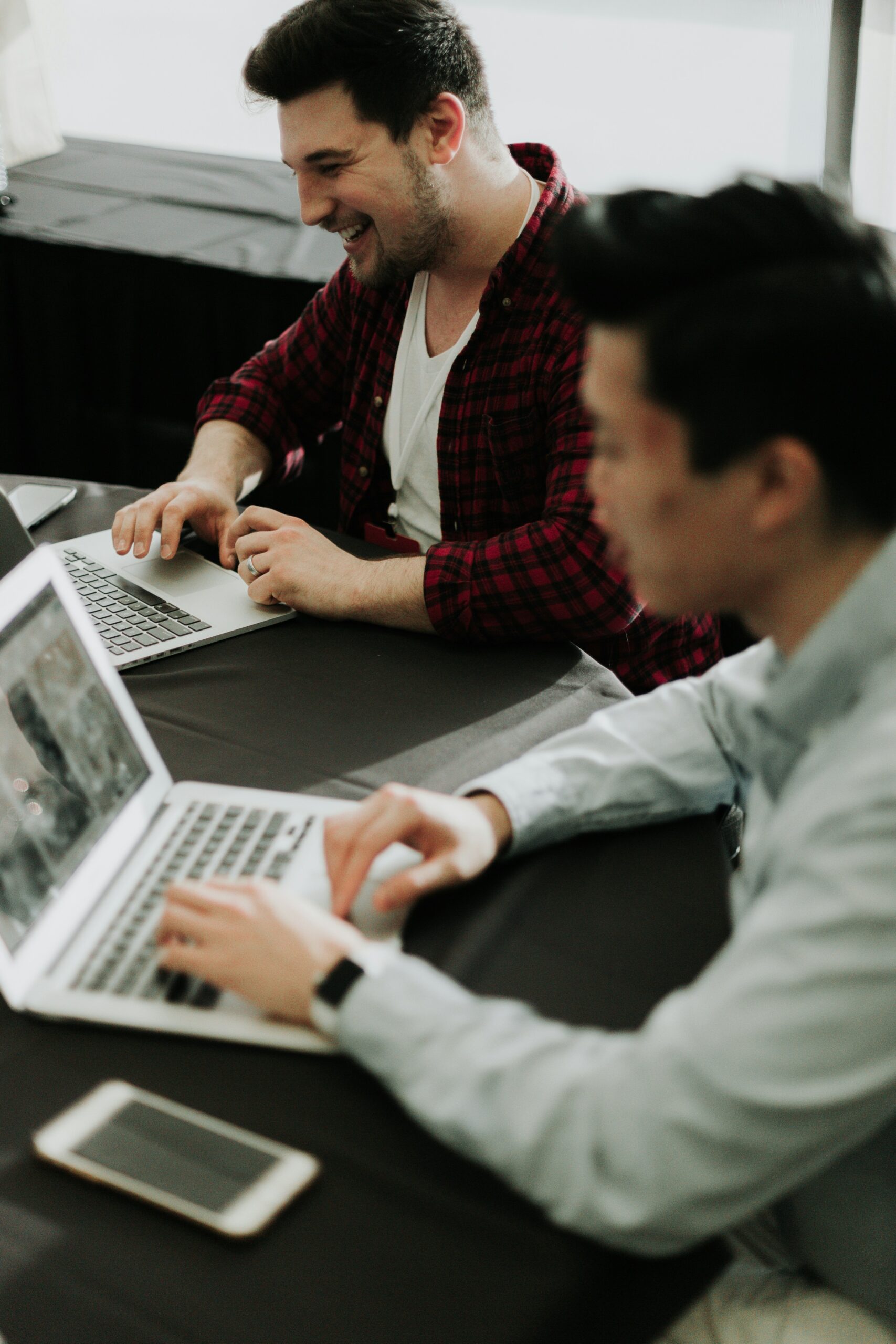 Two professionals optimizing website content on laptops, highlighting the importance of preparing images with proper filenames, alt text, and sizes for better search engine rankings. | Day by Day Digital Two professionals optimizing website content on laptops, highlighting the importance of preparing images with proper filenames, alt text, and sizes for better search engine rankings.