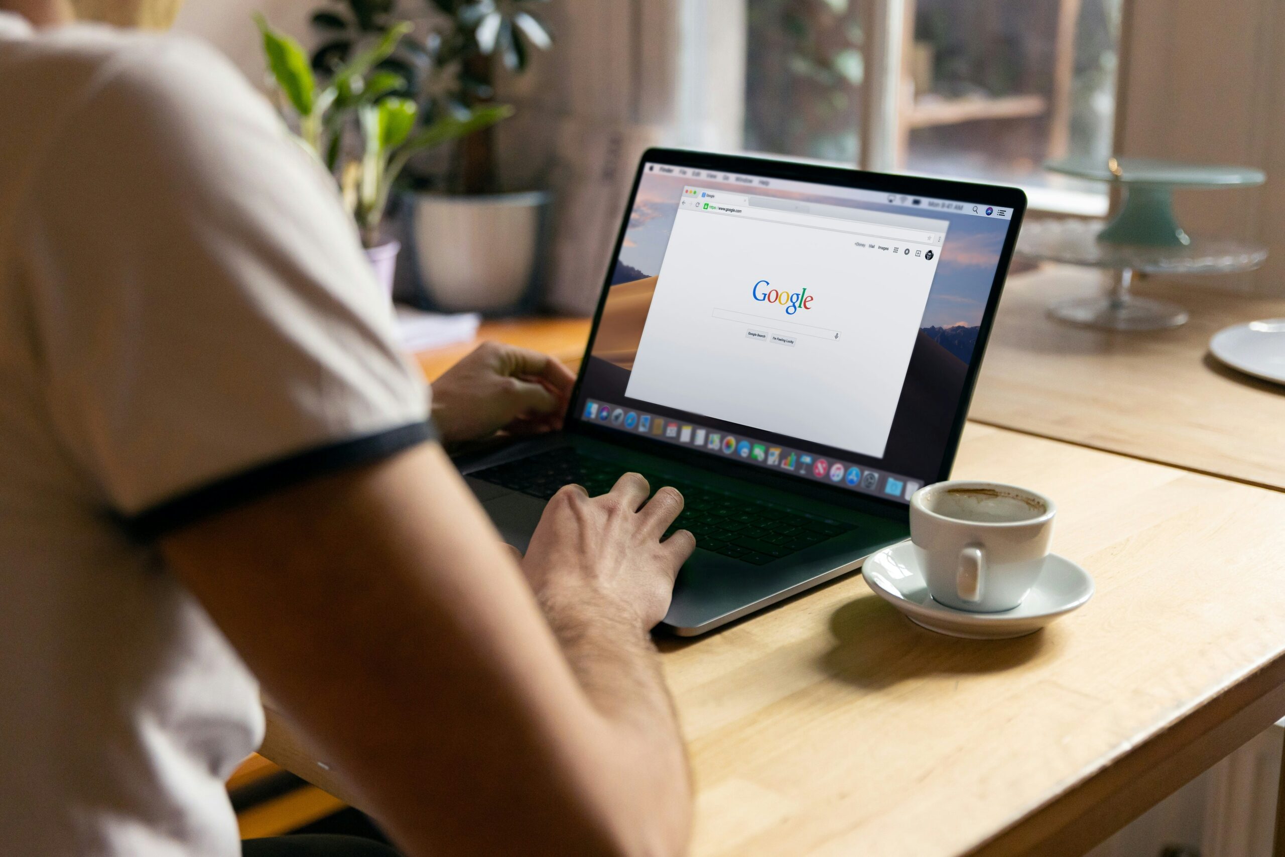a person typing in google search page | Day by Day Digital a person typing in google search page