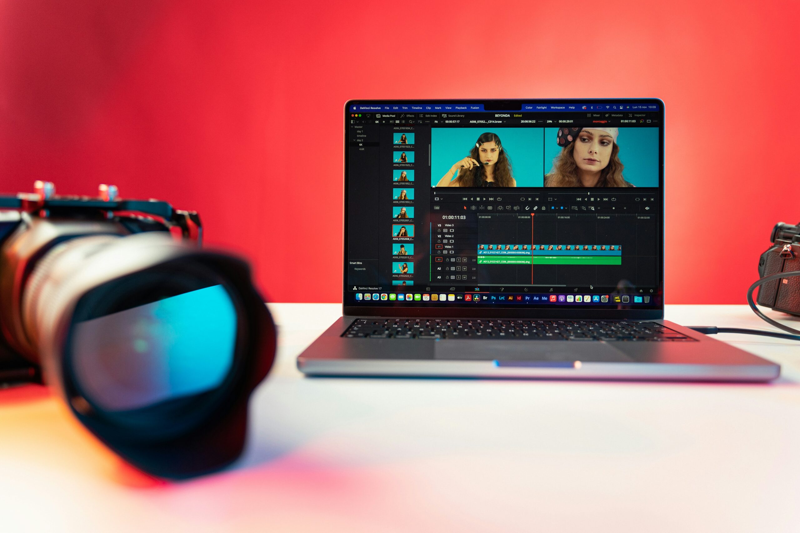 A laptop displaying a video editing interface with camera gear nearby, representing modern video content marketing trends that enhance SEO. | Day by Day Digital A laptop displaying a video editing interface with camera gear nearby, representing modern video content marketing trends that enhance SEO.