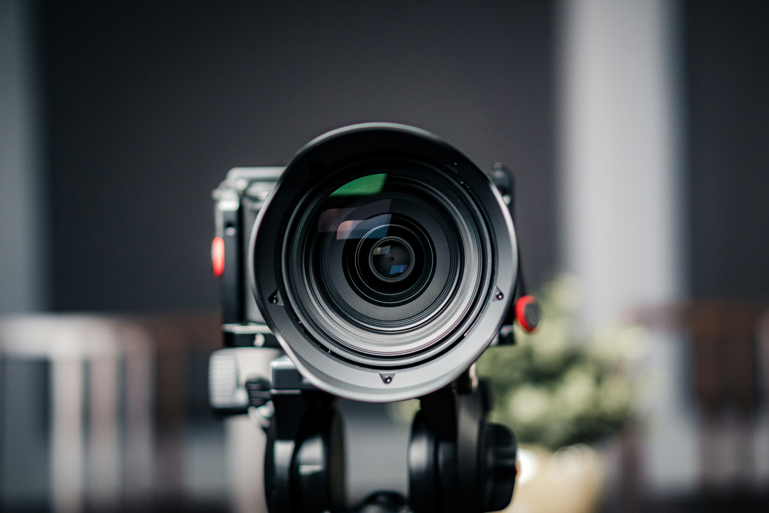 A close-up of a professional video camera lens, representing video as a high-impact format for SEO-optimized content. | Day by Day Digital A close-up of a professional video camera lens, representing video as a high-impact format for SEO-optimized content.